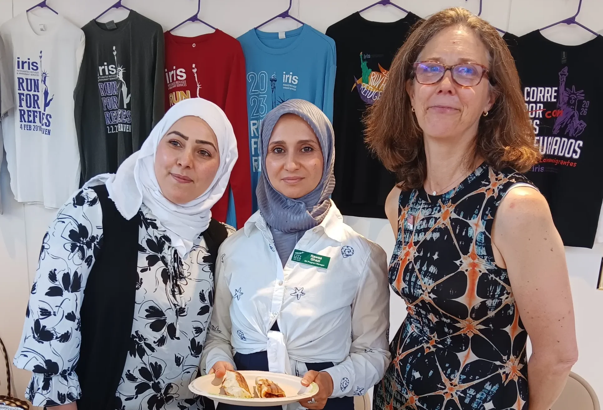 IRIS Executive Director Maggie Mitchell Salem (right), with Sanctuary Kitchen directors Aminah Alsaleh and Rawaa Ghazi.